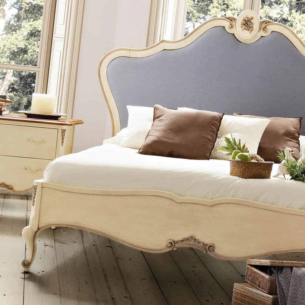 Elegant Wooden Bed with Hand-Carved Detailing and Tufted Headboard